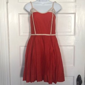 Cute coral dress with adorable detail!